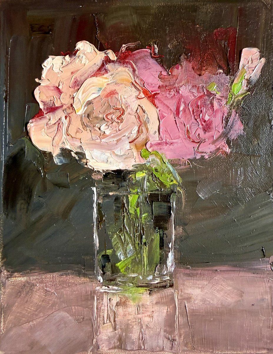 Oil painting of pink and peach roses in a glass vase against a dark ground.